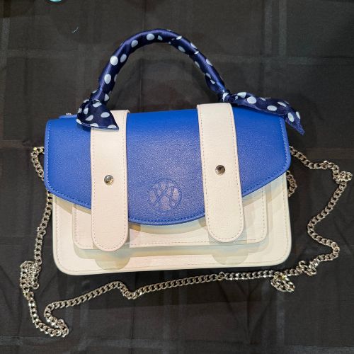 Blue and white Waterloo Bags purse with a polka dot scarf